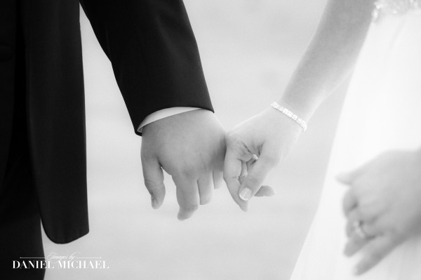 Bride and groom holding hands