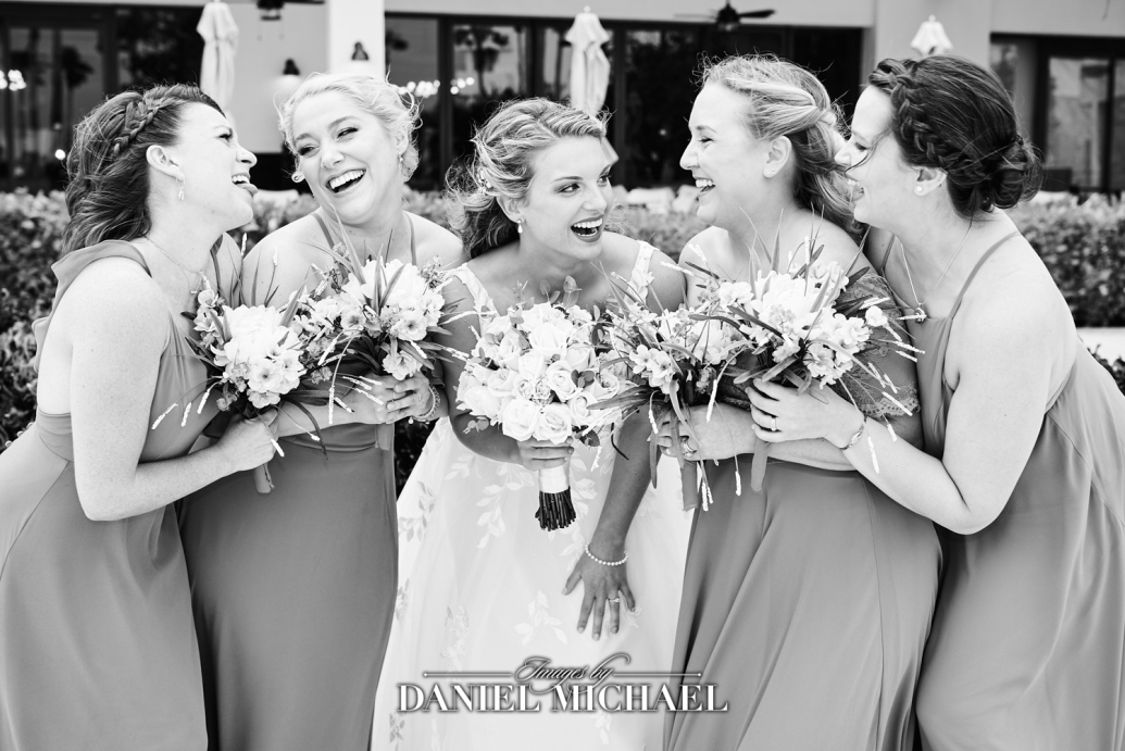 Bride and bridesmaids laughing