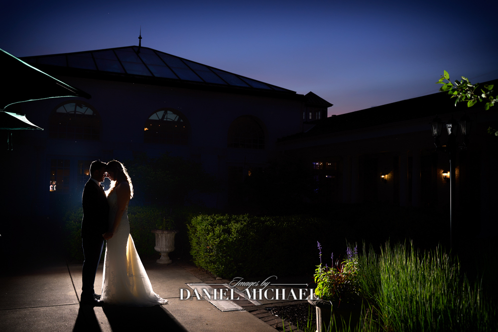 Silhouettes of couple on sidewalk